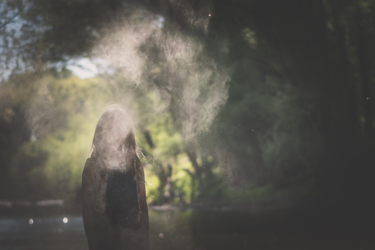 little child in dusty atmosphere in river bank, weird image